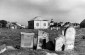 Klimontow, broken gravestones in the Jewish cemetery with houses of the town in the background.© Yad Vashem Photo archives